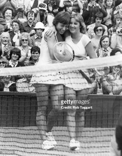 Martina Navratilova gets a hug from Chris Evert , after beating her in the final of the ladies' singles at the Wimbledon tennis championships,...