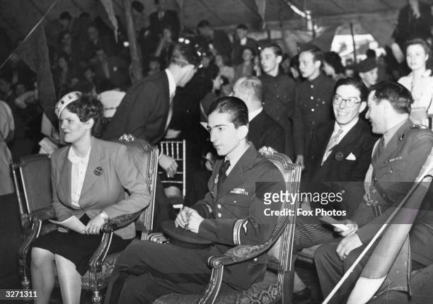 Princess Romanovsky Pavlovsky and King Peter of Yugoslavia attend a circus held on Hampstead Heath, London. C B Cochrane presented Rosaries Circus...