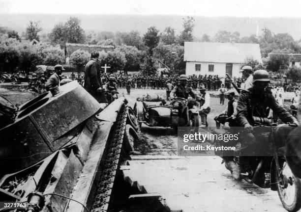 Nazi motorised troops on one of their operations in the Ukraine, which was invaded during late July.