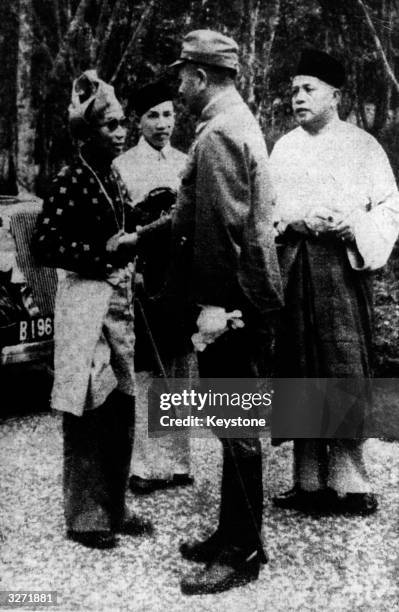The Sultan of one of the states of Borneo welcomes the Japanese Commander of the Army of occupation.