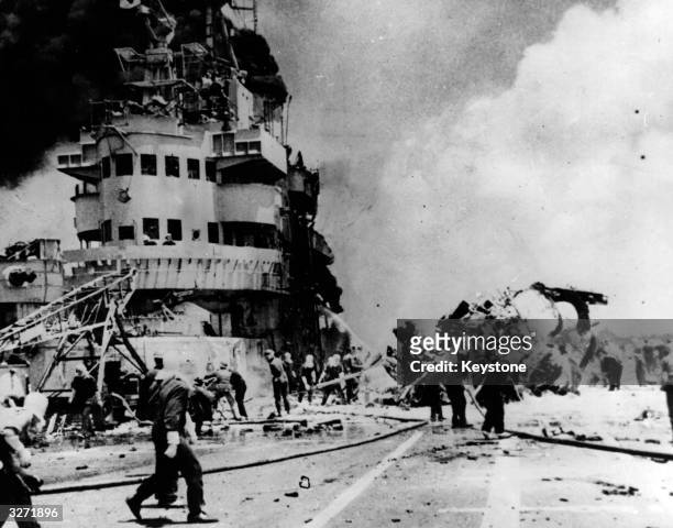 Kamikaze pilot scores a direct hit on a US aircraft carrier in the Pacific Ocean.