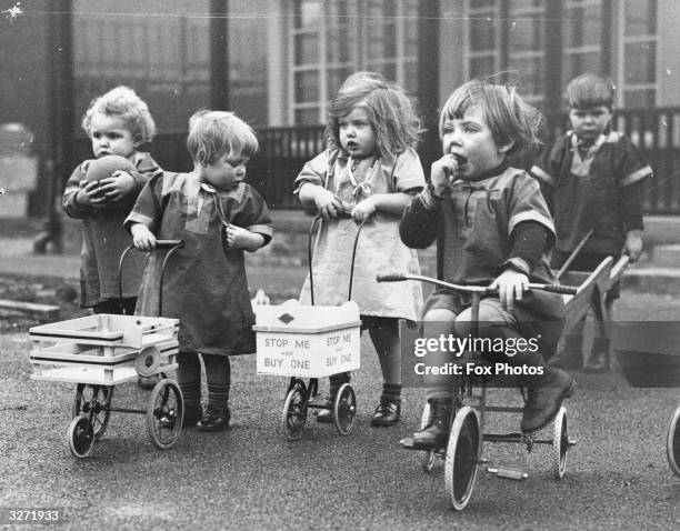 Children in the playground of the new nursery school at Castleford, Yorkshire, opened as an experiment by the West Riding Committee. The school...