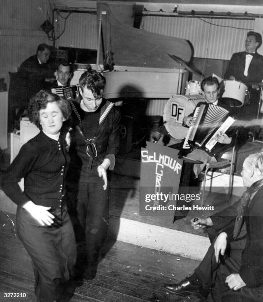 People dancing in front of the band in the ballroom at the Palais de Danse in Plymouth. Original Publication: Picture Post - 7161 - The Best and...