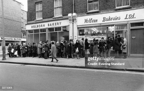 People queuing at the Holborn bakery in Lambs Conduit Street, for the next delivery of bread during the Industrial dispute.