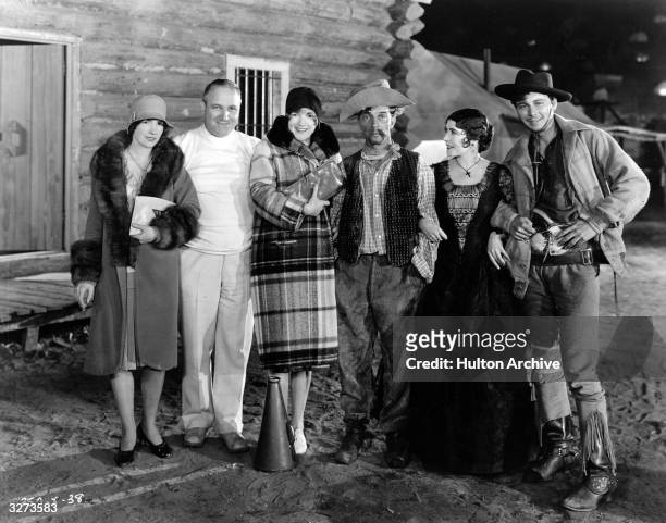 Cast and visitors on the set of 'The Tide Of Empire', directed by Allan Dwan. L-R: Natalie Talmadge Keaton, Allan Dwan, Constance Talmadge, Buster...
