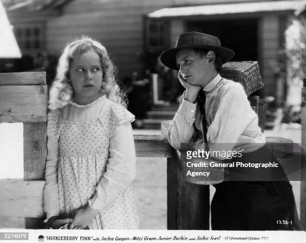 Mitzi Green , the stage name of Elizabeth Keno, the American child actress and Jackie Coogan , the American child actor who achieved star status, as...
