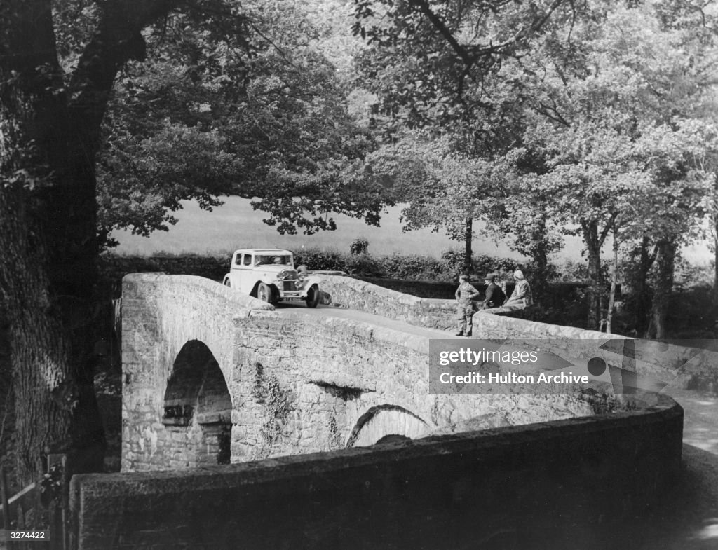 Devon Bridge A car on Holne Bridge over the river Dart in Devon. News Photo - Getty ...
