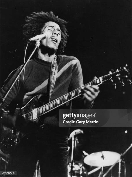 Bob Marley , the singer, guitarist and composer of reggae music in concert.