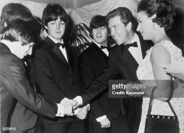 Lord Snowdon and Princess Margaret meet The Beatles, left to right: Ringo Starr, Paul McCartney and John Lennon , at the world premiere of their new...