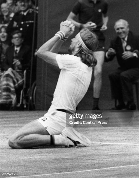 Swedish tennis player Bjorn Borg on his knees at Wimbledon after beating Jimmy Connors for the Championship title.