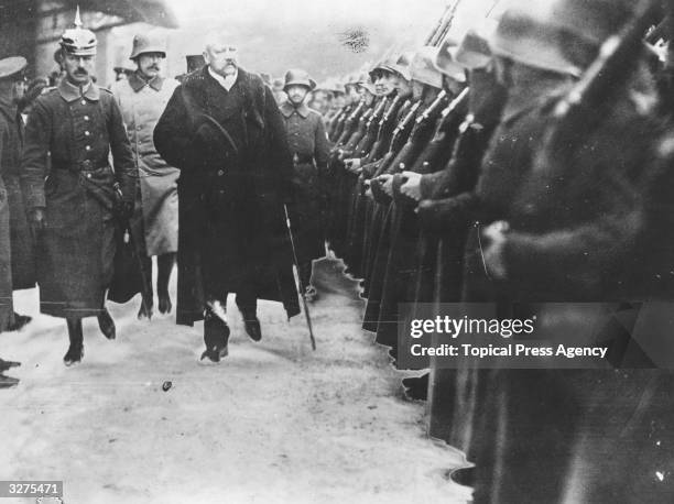 The German soldier and president Paul von Beneckendorff und von Hindenburg, , inspects a guard of honour in Berlin. Recalled from retirement to serve...