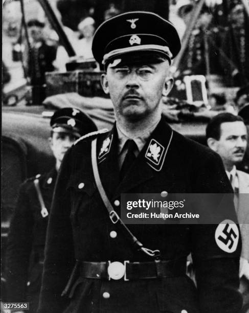 Heinrich Himmler , chief of the SS and the Gestapo dressed in SS uniform.