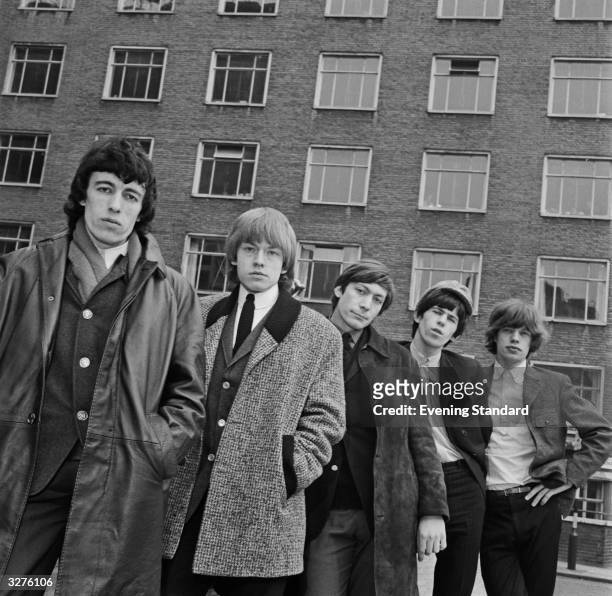 British rhythm and blues group The Rolling Stones posed by the Centrepoint office building in St Giles, London. From left to right: Bill Wyman, Brian...