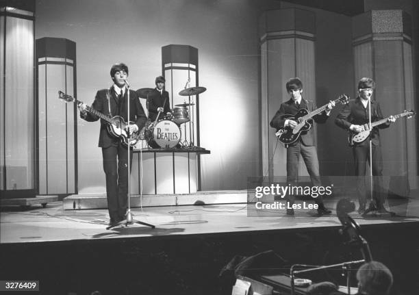 The Beatles, from left to right: Paul McCartney, Ringo Starr, George Harrison and John Lennon in concert at the London Palladium.