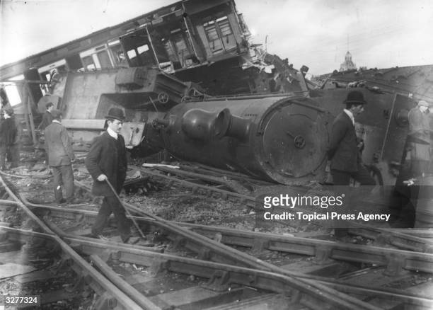 Men inspecting the damage after a train crash at Shrewsbury. The engine was a 4-6-0 Stephenson.