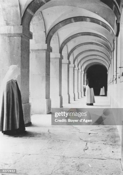 Carmelite nuns in the cloisters of their nunnery.