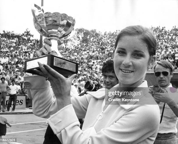 American tennis player Chris Evert holding the trophy after winning the women's title at the French Open in Paris.