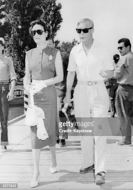 The Duke and Duchess of Windsor take a stroll at the Lido, Venice, where they are attending the International Film Festival.