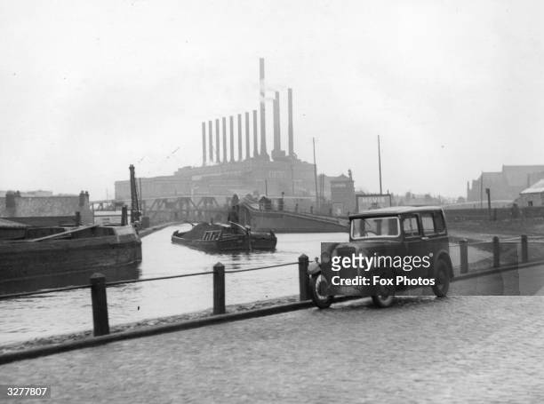 View of Bridgewater canal in Manchester with the factory chimneys in the background.