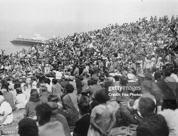 Thousands of holiday makers watching a Miss Personality competition at Happy Valley, Llandudno, Wales.