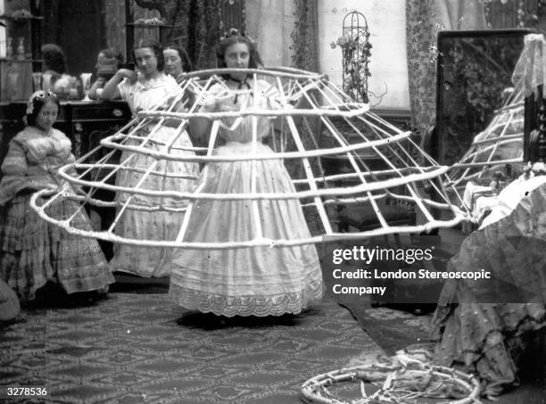 The scene from a ladies dressing room, preparing for the crinoline. London Stereoscopic Company Comic Series - 503