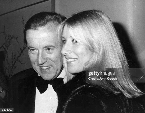 David Paradine Frost, broadcaster and businessman attending the BAFTA awards with his wife Lady Karina, the daughter of the Duke of Norfolk.