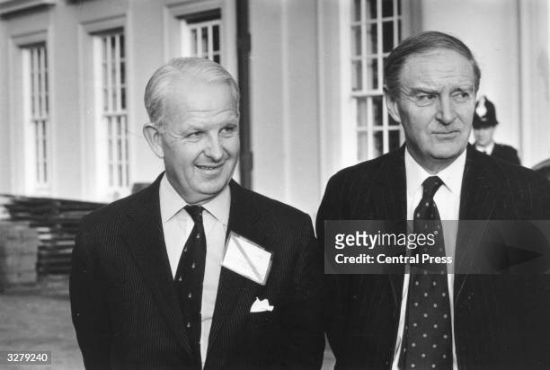 Brian Faulkner the Unionist leader of Northern Ireland with Liam Cosgrave the Prime Minister of Eire in the garden of the Civil Service College at...