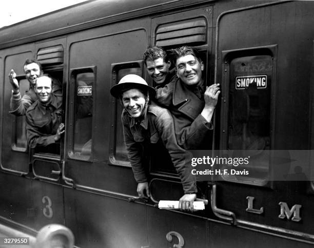 Members of the British forces arrive home by train after being evacuated from Dunkirk.