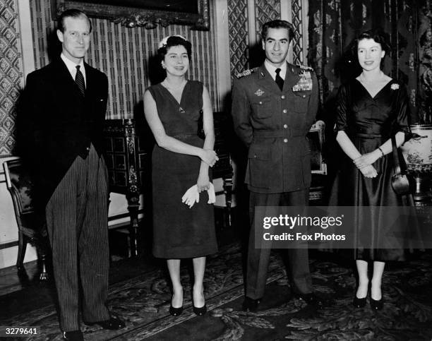 Royal guests at Buckingham Palace. From left to right, HRH the Duke of Edinburgh, Queen Soraya of Persia, The Shah of Persia and HM The Queen.