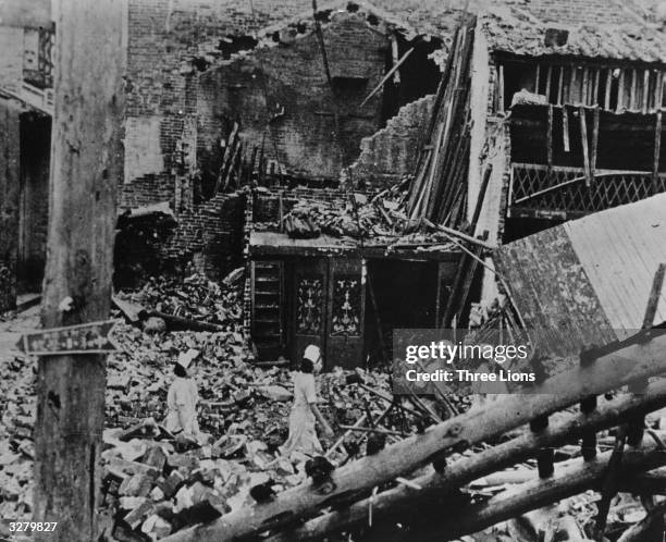 Searching for victims of bombing raids in the ruins of Changsha, during the Sino-Japanese war.