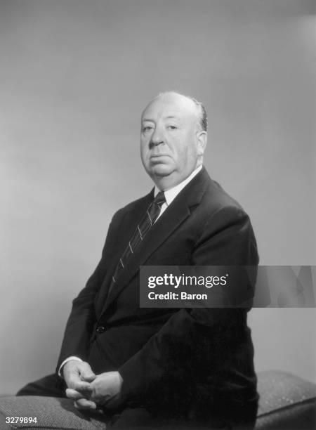 Alfred Hitchcock , British film director.