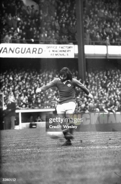 Northern Irish football player George Best, in action for Manchester United against Queens Park Rangers at Loftus Road.
