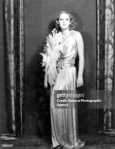 german-film-actress-brigitte-helm-in-an-evening-dress-complete-with-feather-boa.jpg