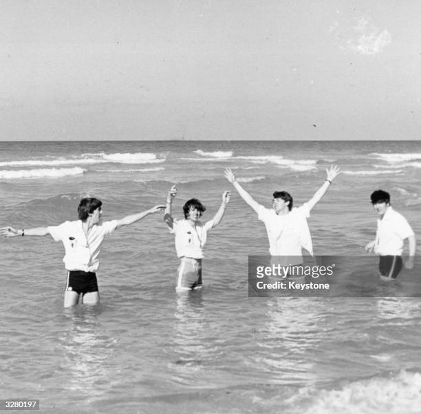 Pop group The Beatles, from left to right; George Harrison , Ringo Starr, Paul McCartney and John Lennon , enjoying the Florida sea and sunshine at...