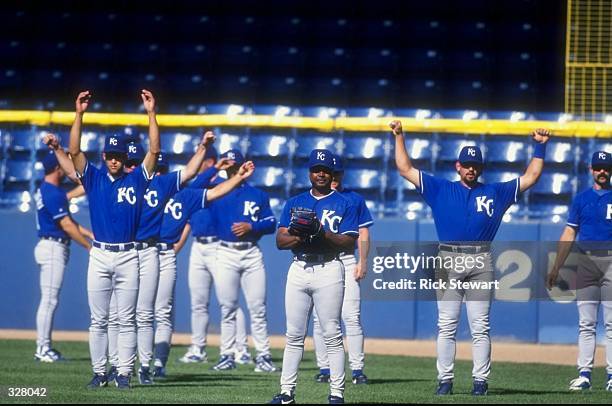 General view as members of the Kansas City Royals team stretch during the game against the Detroit Tigers at Tiger Stadium in Detroit, Michigan. The...