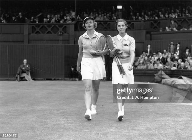 Britain's Kay Stammers and Alice Marble of the USA walking onto the Wimbledon court to play the Women's Singles Final, which Marble won.