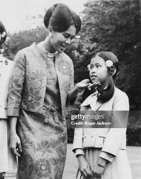 Queen Sirikit of Thailand and her nine year old daughter Princess Chulabhorn at her Sunninghill residence in Berkshire.