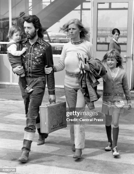 Paul McCartney, singer, songwriter and bass player for the recently disbanded Beatles, with his wife Linda and their two children, Mary and Heather...