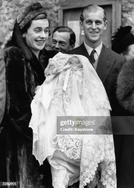 Lieutenant Mountbatten, the Godfather, with Lady Brabourne and her baby son after the christening.