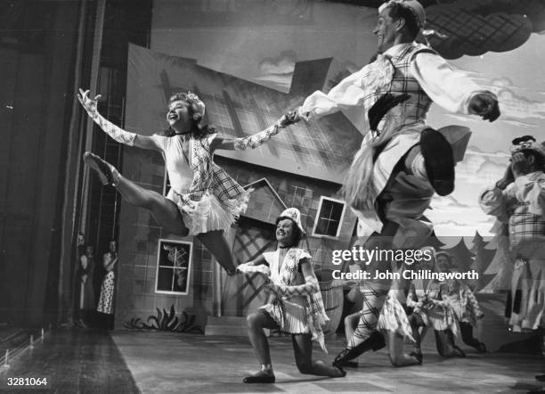 American dancer Vera-Ellen , born Vera-Ellen Westmeyr Rohe leaping across the set of the N P Rathvon musical 'Happy Go Lovely' at Elstree Studios,...