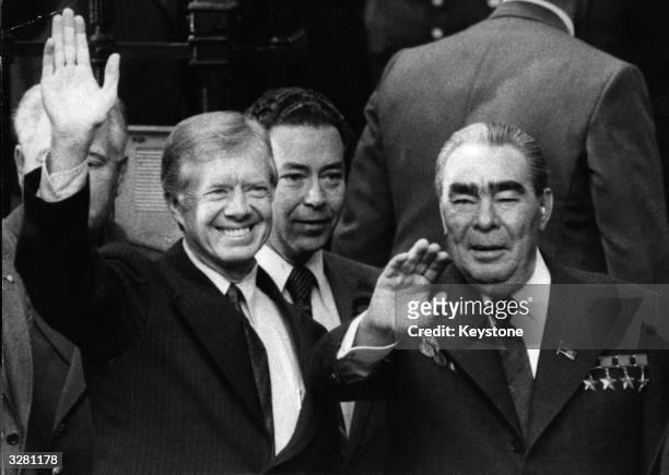 American statesman Jimmy Carter, the 39th President of the United States, and the Soviet leader Leonid Brezhnev wave after signing the Strategic Arms...