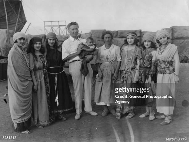 Director Fred Niblo poses with some of the extras for the MGM film 'Ben Hur: A Tale of the Christ' circa 1924.