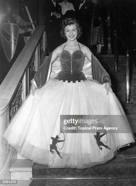 Joan Rice the British leading lady who was formerly a waitress is at the Empire cinema for the premiere of 'Ivanhoe'. She is wearing a white and...