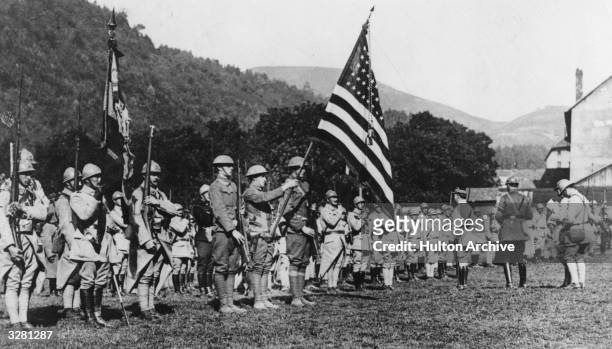 American soldiers in Alsace carrying their flag during WWI.