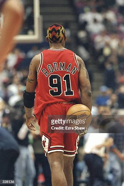 Dennis Rodman of the Chicago Bulls in action during the NBA Playoffs round 3 game against the New Jersey Nets at the Continental Airlines Arena in...