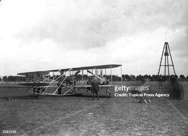 Paul Tissandier's Wright Biplane at the Reims Aviation Week, with tail number 4 and its launching pylon and rails. He performed the first flight of 1...