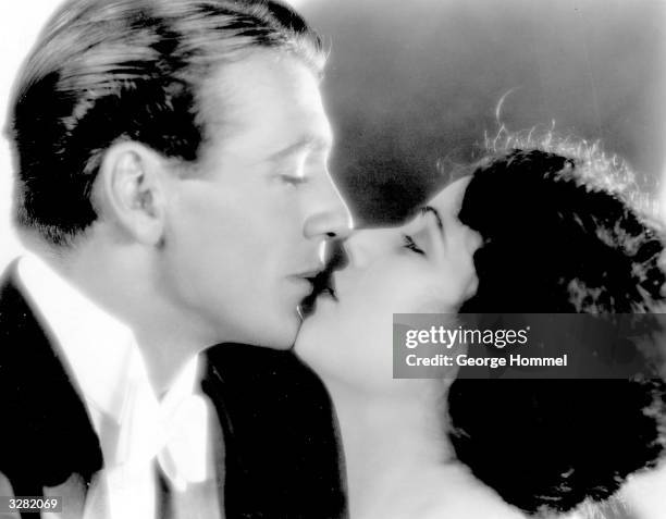 Gary Cooper experiences a moment of barely suppressed passion with Fay Wray, female star lead of King Kong.