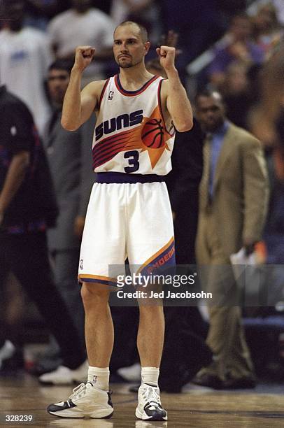 Rex Chapman of the Phoenix Suns with his arms in the air during the Western Conference Playoffs Round 1 game against the San Antonio Spurs at the...