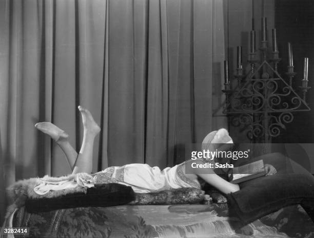 Actress Thalia Barbarova settles down for a bedtime read in a role onstage.