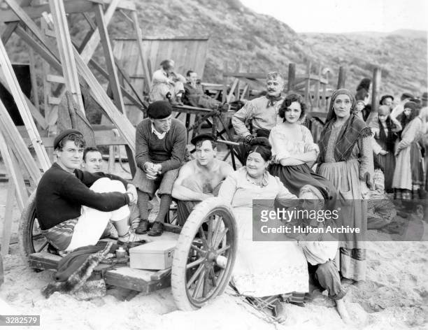 Between scenes on the beach during the filming of 'The Runaway Enchantress', Milton Sill's the American leading man is starring for First National....